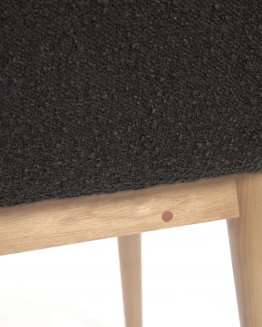Konna chair in black fleece with solid ash wood legs in a natural finish