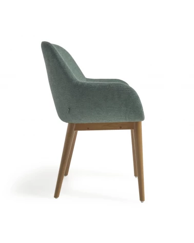 Konna chair in green with solid ash wood legs in a dark finish